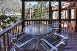Dining/Game table on lower level steps out to covered deck